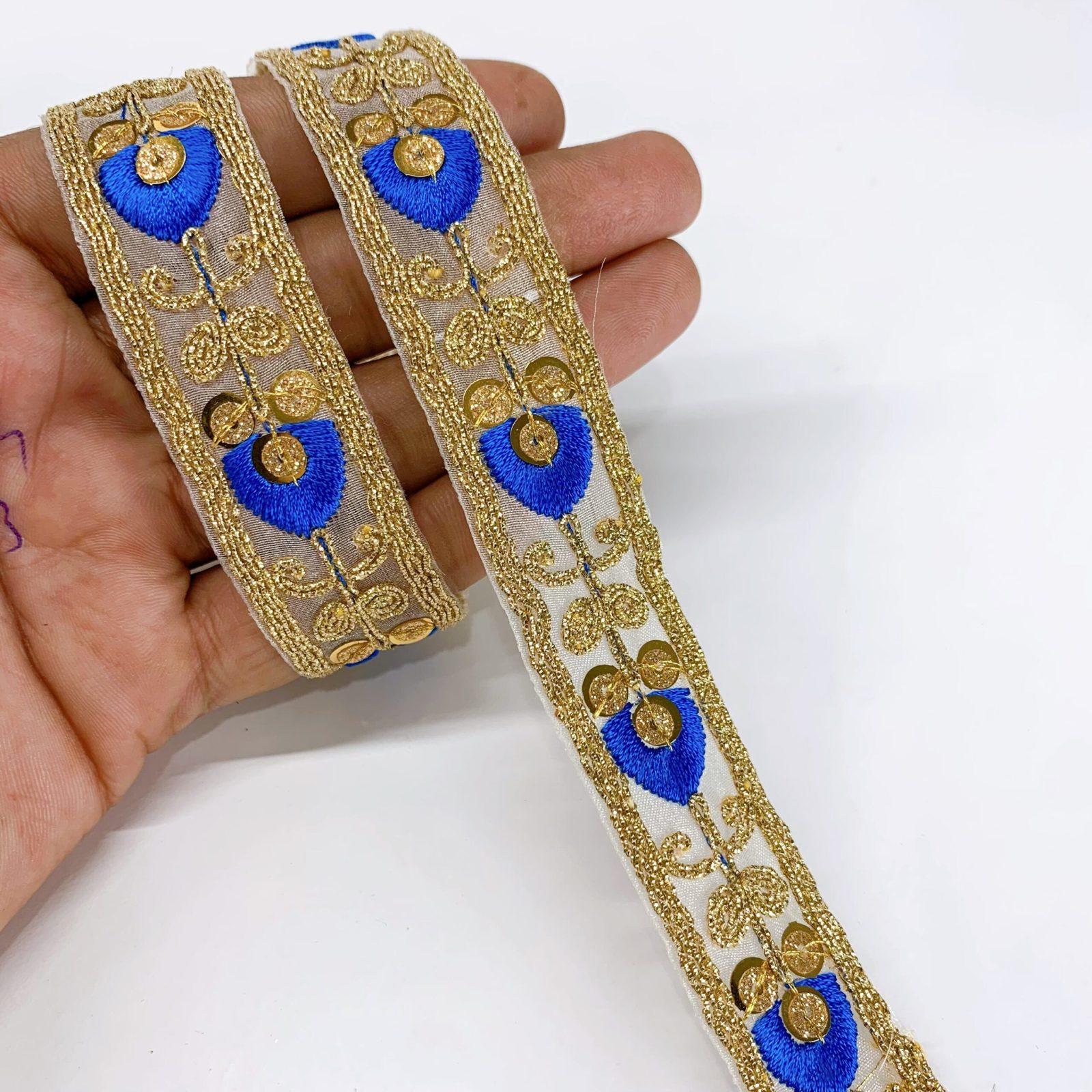 20mm Leaf Design Embroidery lace with Golden Sequins and Dori Work Border, shown on white cotton