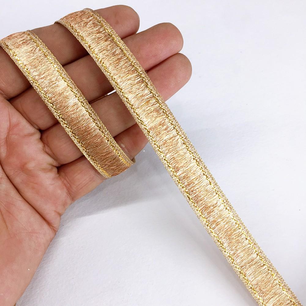 13 mm Thick Gold Metallic Zari Ribbon, shown on white cotton