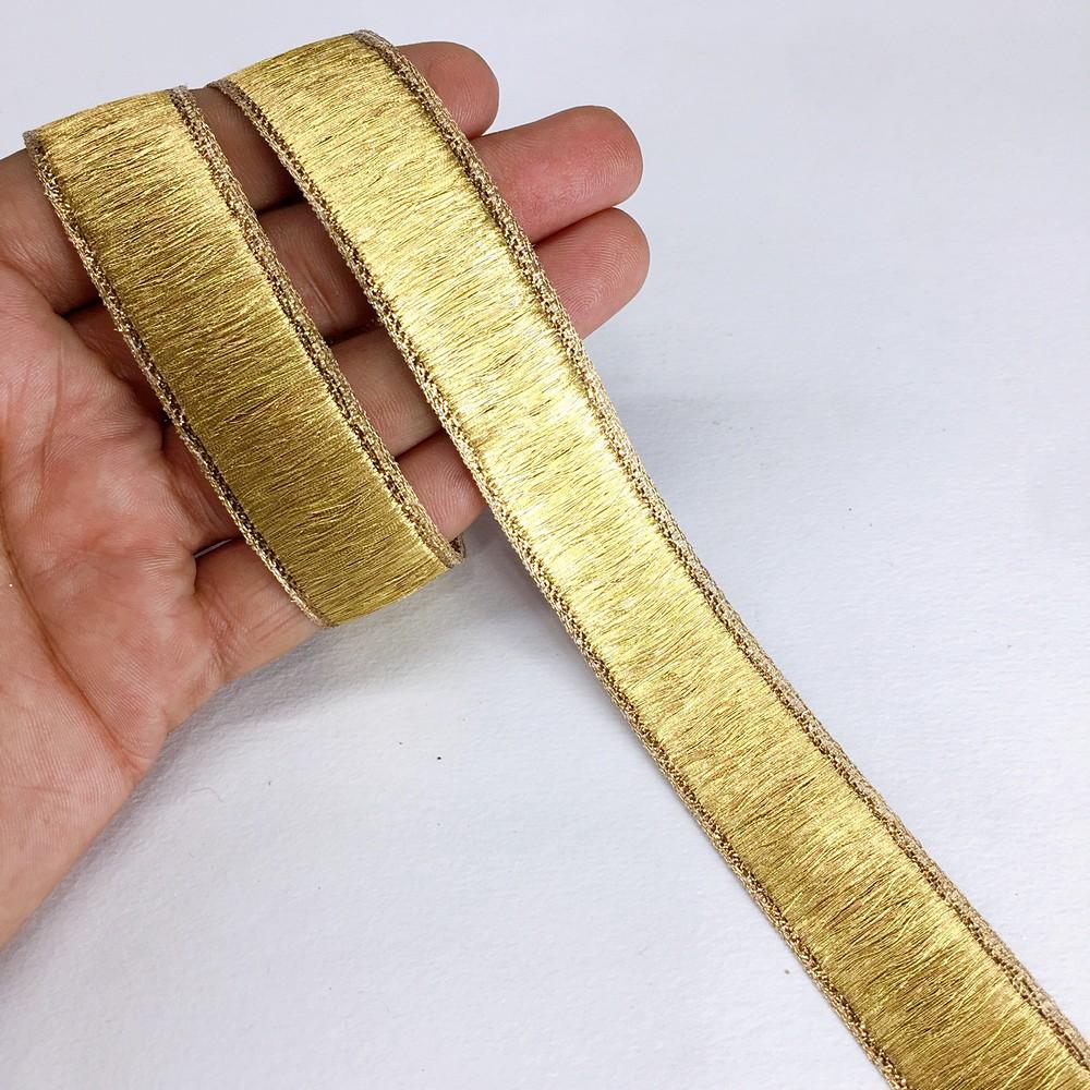 24 mm Thick Gold Metallic Zari Ribbon, shown on white cotton