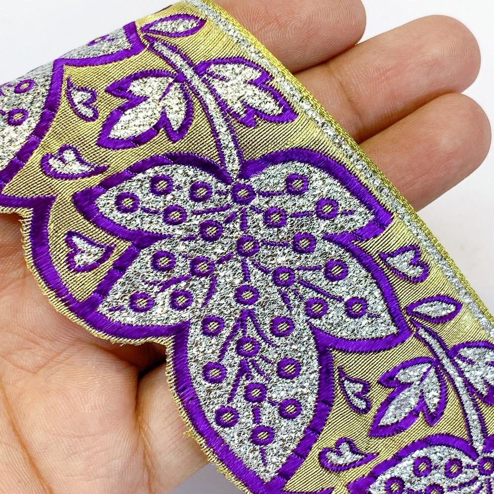 52 mm Designer Pan Cutwork Jacquard Ribbons, shown on white cotton