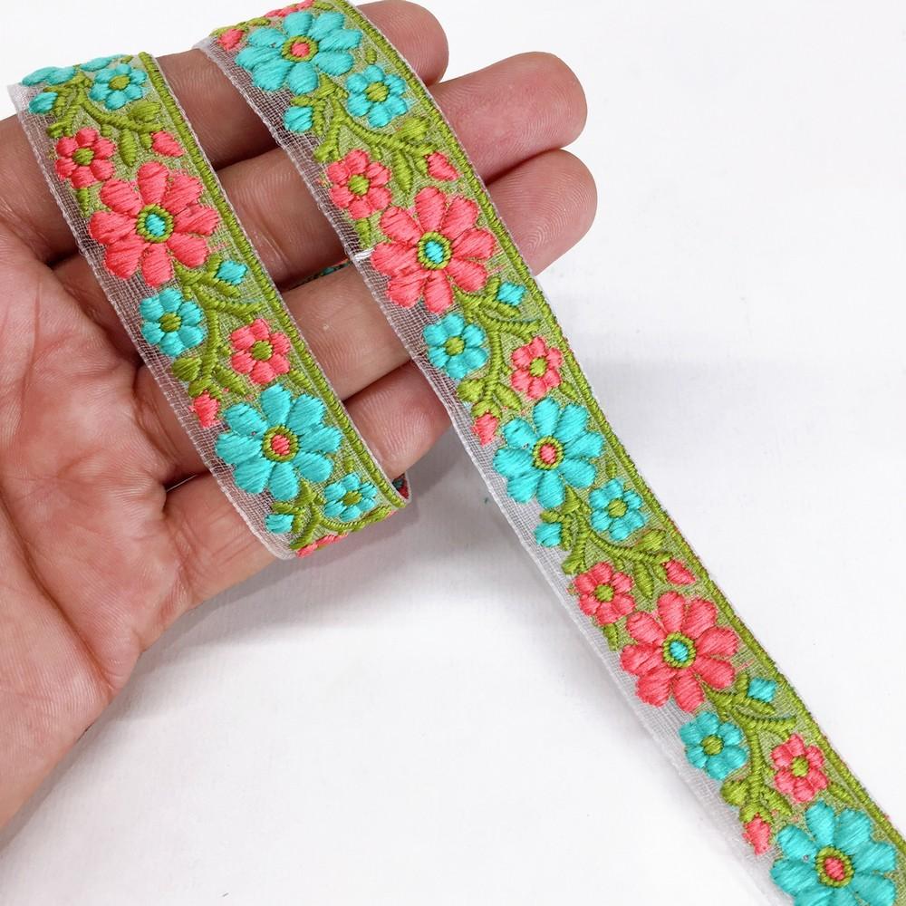 20mm Organza back flower creeper Jacquard trim, shown on white cotton