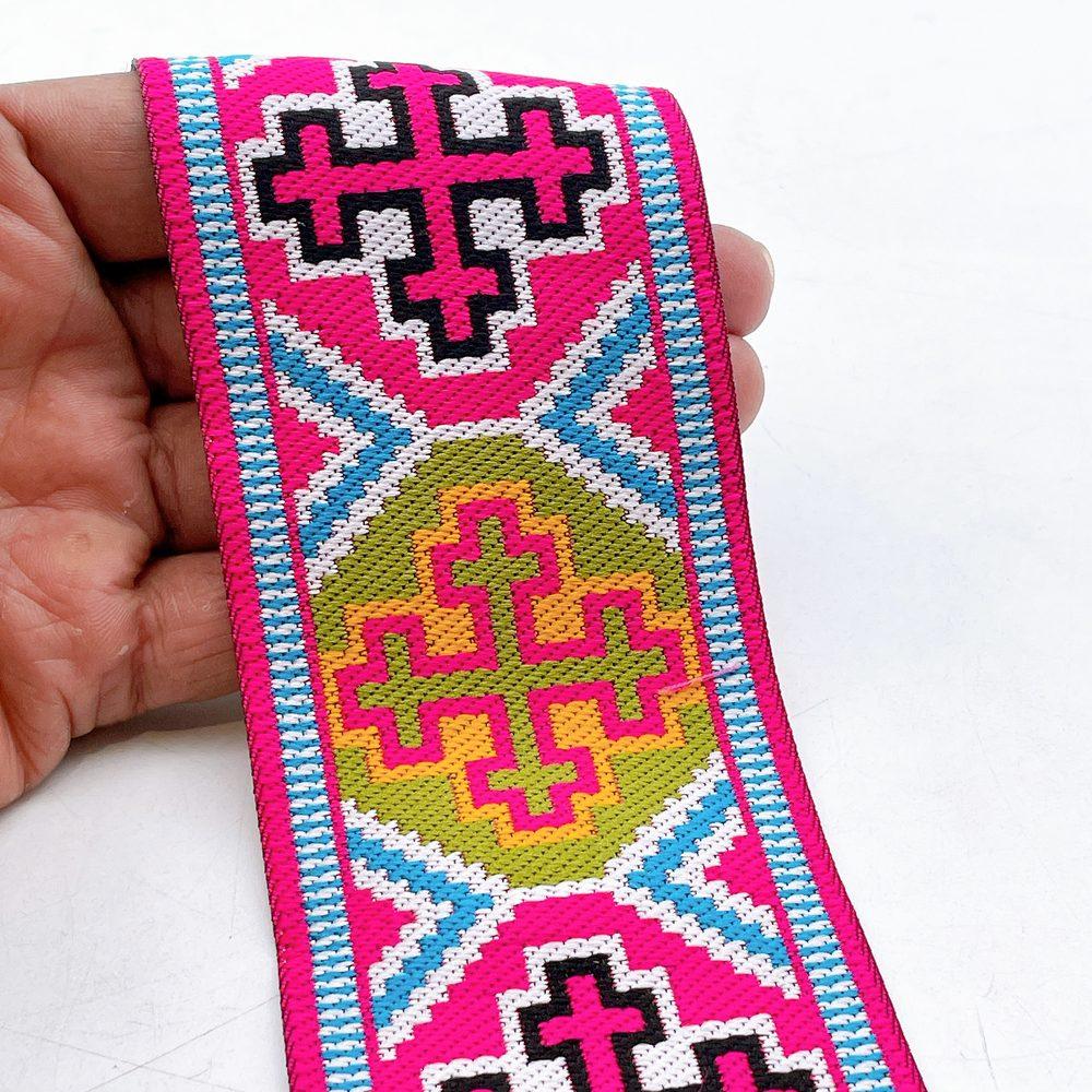65mm Wide Tribal Jacquard Ribbon Trim - Colorful Geometric Tapestry Border for Bag Straps and Apparel, shown on white cotton