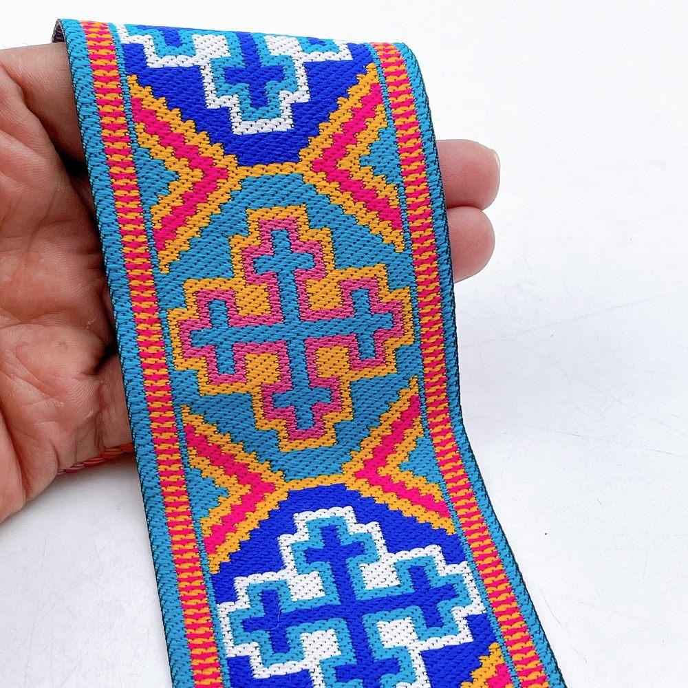 65mm Wide Tribal Jacquard Ribbon Trim - Colorful Geometric Tapestry Border for Bag Straps and Apparel, shown on white cotton