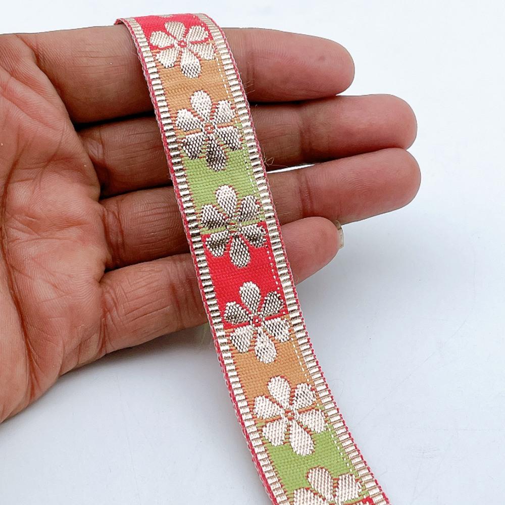 20mm Floral Zari Motif Ribbon - Shimmering Border for Lehengas and Crafts, shown on white cotton