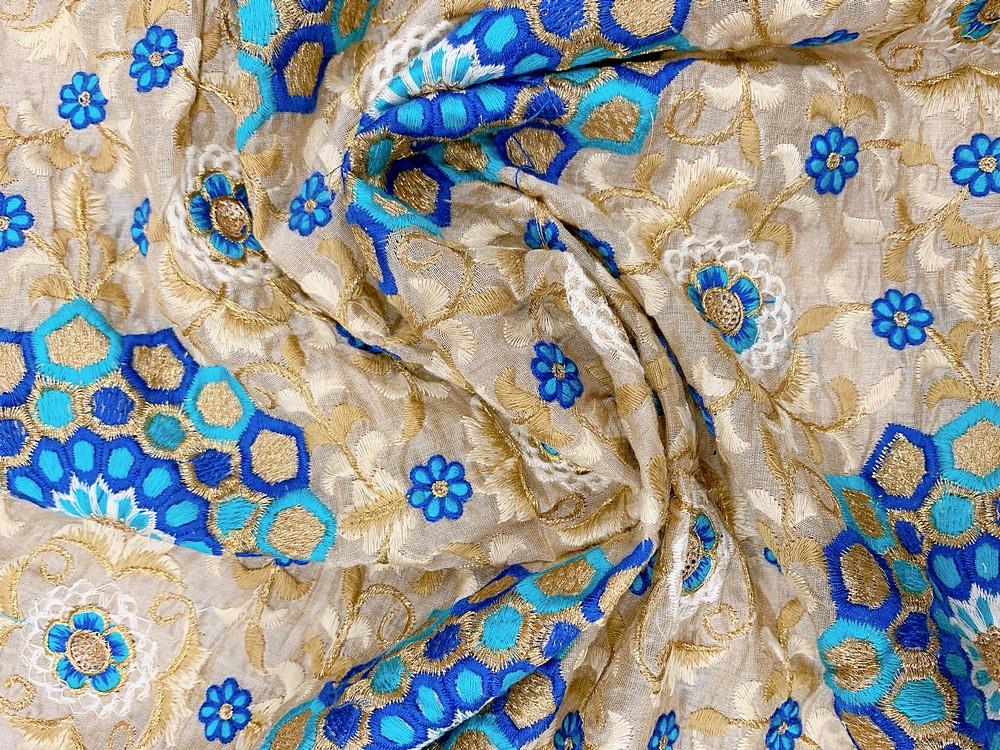 Embroidery Work On Cotton Fabric, shown on white cotton