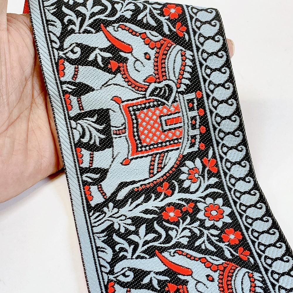 100mm Elephant Design Banarasi Jacquard Lace, shown on white cotton