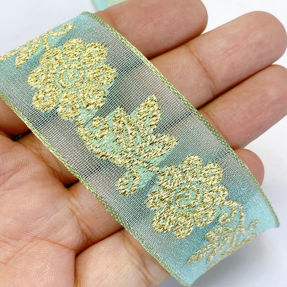 25mm Designer Jacquard Ribbon With Zari Threads, shown on white cotton
