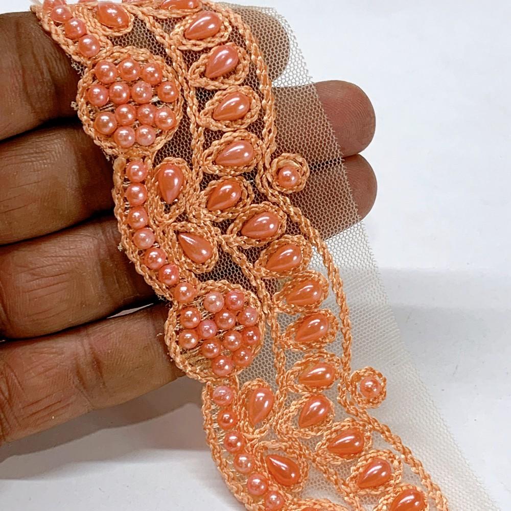 35mm Embroidered Beaded Lace Trim on Net, shown on white cotton