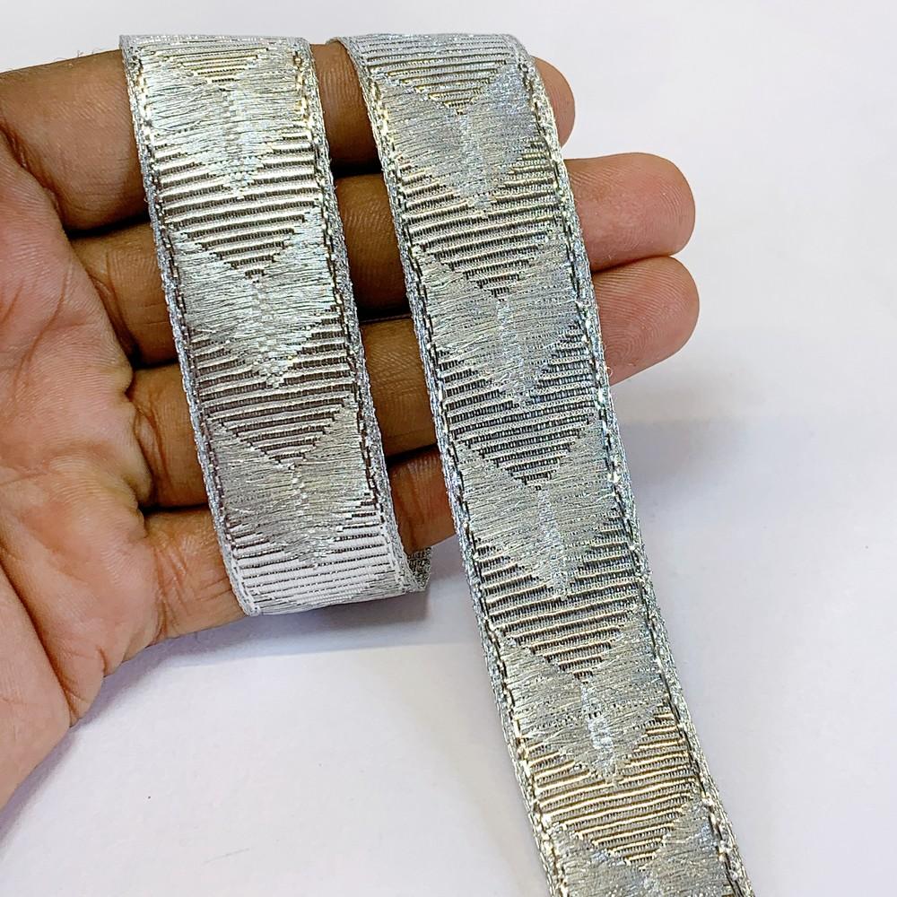 22mm Textured Metallic Zigzag Woven Jacquard Ribbon, shown on white cotton