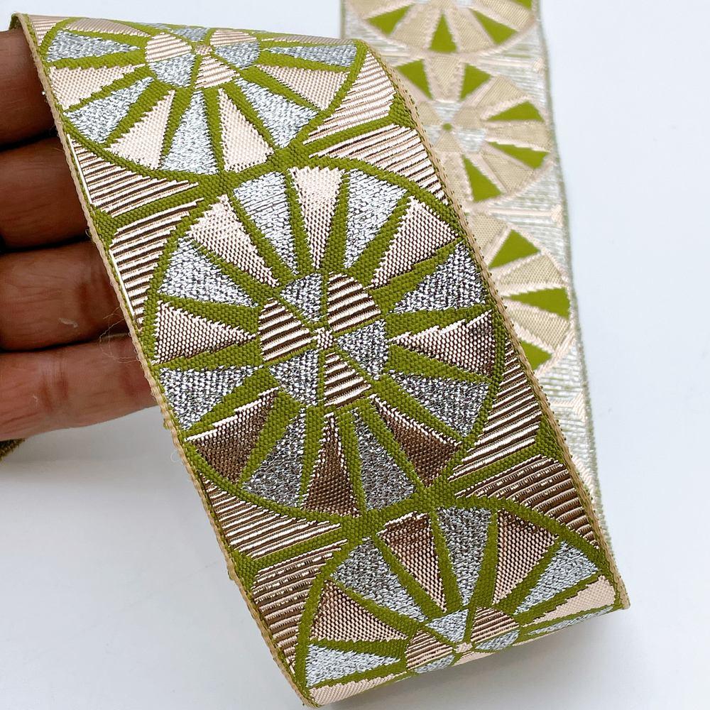 60mm Wide Colorful Sunburst Gota Work Jacquard Ribbon - Woven Border, shown on white cotton