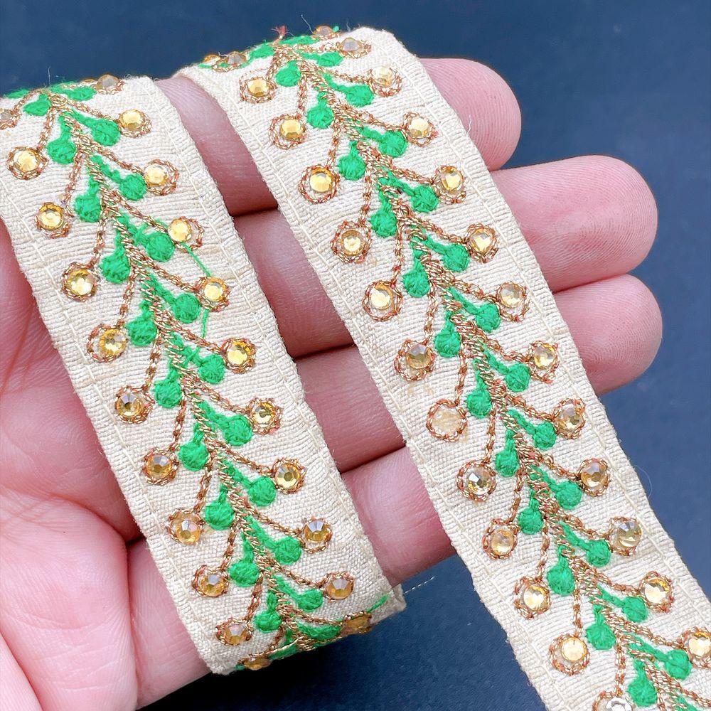 22mm Embroidered Vine Lace Trim - Sequin Botanical Border for Apparel and Crafts, shown on white cotton