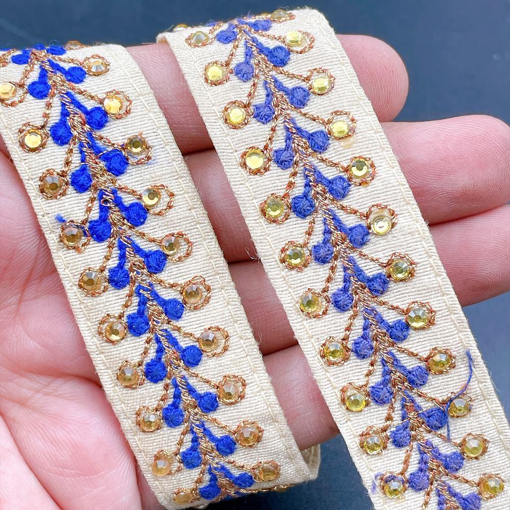 22mm Embroidered Vine Lace Trim - Sequin Botanical Border for Apparel and Crafts, shown on white cotton