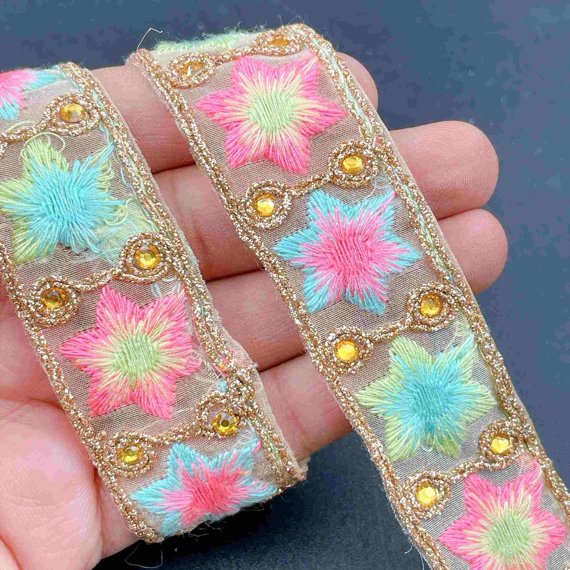 28mm Premium Embroidered Net Tape with Star Motif and Sequined Edge, shown on white cotton